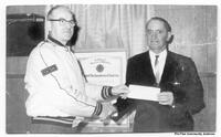 Willis Ayers recieving donation for Genral Hospital