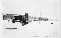 Lyn Tractor Freight Train on the ice road to Island Falls 1928