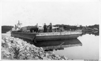 Steam boat pushing a barge