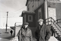 Two men outside Main Office