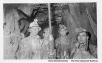 Four Miners and drill possibly Carbide Lamps