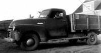 Harvey Evans driving Geo. W. Evans Ltd Truck