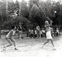 Woman's baseball game action