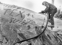 Man with what appears to be a Jack Hammer 