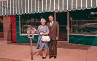 Mary Prston and Earnest Preston in front of Preston's Jewlry Store 