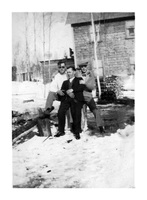 Three unidentified men outside Ross Lake Room Flin Flon C 1932