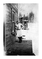 Woman (Possibly Laura Peltoniemi) on porch of Ross Lake Rooms C 1932