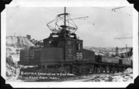 Electric Locomotive and Ore Cars in The Open Pit HBM&S 1930