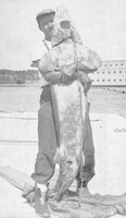 Hugging a Sturgeon - Island Falls