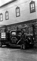  Norm Neusted and a truck belonging to Geo. W. Evans Ltd. 