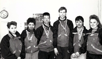 Special Olympics team with medals.