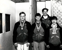 Special Olympics athletes wearing medals.