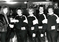 (L-R) Donna Reid presenting to unknown team members. 