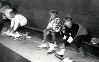 Girls in their change room putting on skates.