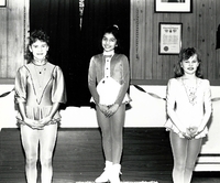 Three young lady skaters on the podium.