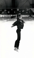Young figure skater performing.