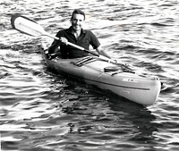 Solo kayak paddler.