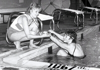 Swimmer getting ready to race in pool.