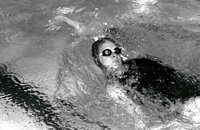 Swimmer doing a back stroke.