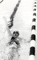 Swimmer doing a back stroke.