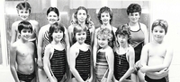 Group of young swimmers posing.