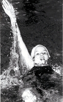 Swimmer racing back stroke.