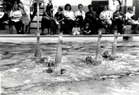 Synchronized swimming in pool.