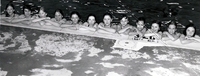 Group of young people in the pool.