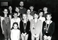 Group photo of young lady swimmers with their medals.
