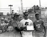 Baseball players posing with award