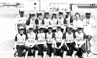 Unidentified girl's ball team with awards