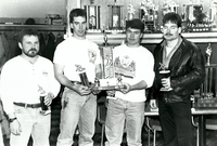 Unidentified team posing with trophy 