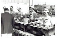 June 1980, Members of the Flin Flon Rotary Club flipping pancakes