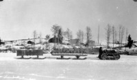 Tractor Hauling Supplies on the Ice, Perhaps North End of Flin Flon Camp C 1927