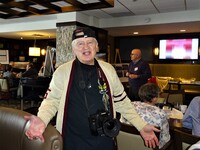 Morley Putney on the job taking photos at the luncheon.
