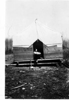 George Evans in his Tent-Cabin Home at Mile 83