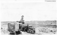 Marion 450 loading blasted rock from site leveling Flin Flon C 1928
