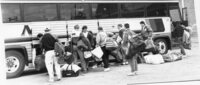 Flin Flon Bomber loading their equipment on the bus to head for Melville 1992-93 season.