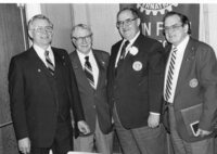 Rotary District Governor Sam McKee presents Paul Harris Awards