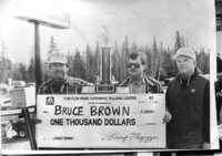 1992 Burbot Derby winner Bruce Brown is presented his $1000 cheque from Flin Flon Home Hardware’s Larry Feszezyn