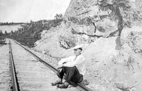 Man Posing on Tracks in Rock Cut Near the Gravel Pit Flin Flon