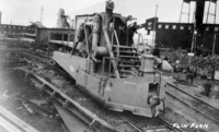 machine to spread the ballast along the tracks.