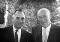 An unidentified person and Maurice A. Roche. 