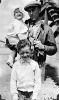 Maurice A. Roche with two of his children.