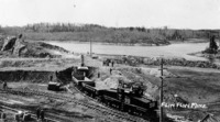 The Marion Shovel and Electric Locomotives removing twety feet of overburden from the are of the Open Pit. C 1929