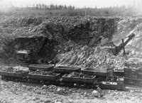 Mariion Shovels loading ore into rail cars in very early operqation of the Open Pit C 1930