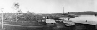 Flin Flon Camp looking South C 1928 Man Working on Barge in Foreground