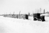Tractor hauling cordwood, liley fuel for the Power House C 1927