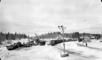 Marion Crane loading sleighs from rail cars at Mile 86 "Power Siding" 1929