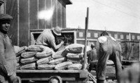 1929 Contruction Period Cement Bags on Trolly Paaiing over Weigh Scales